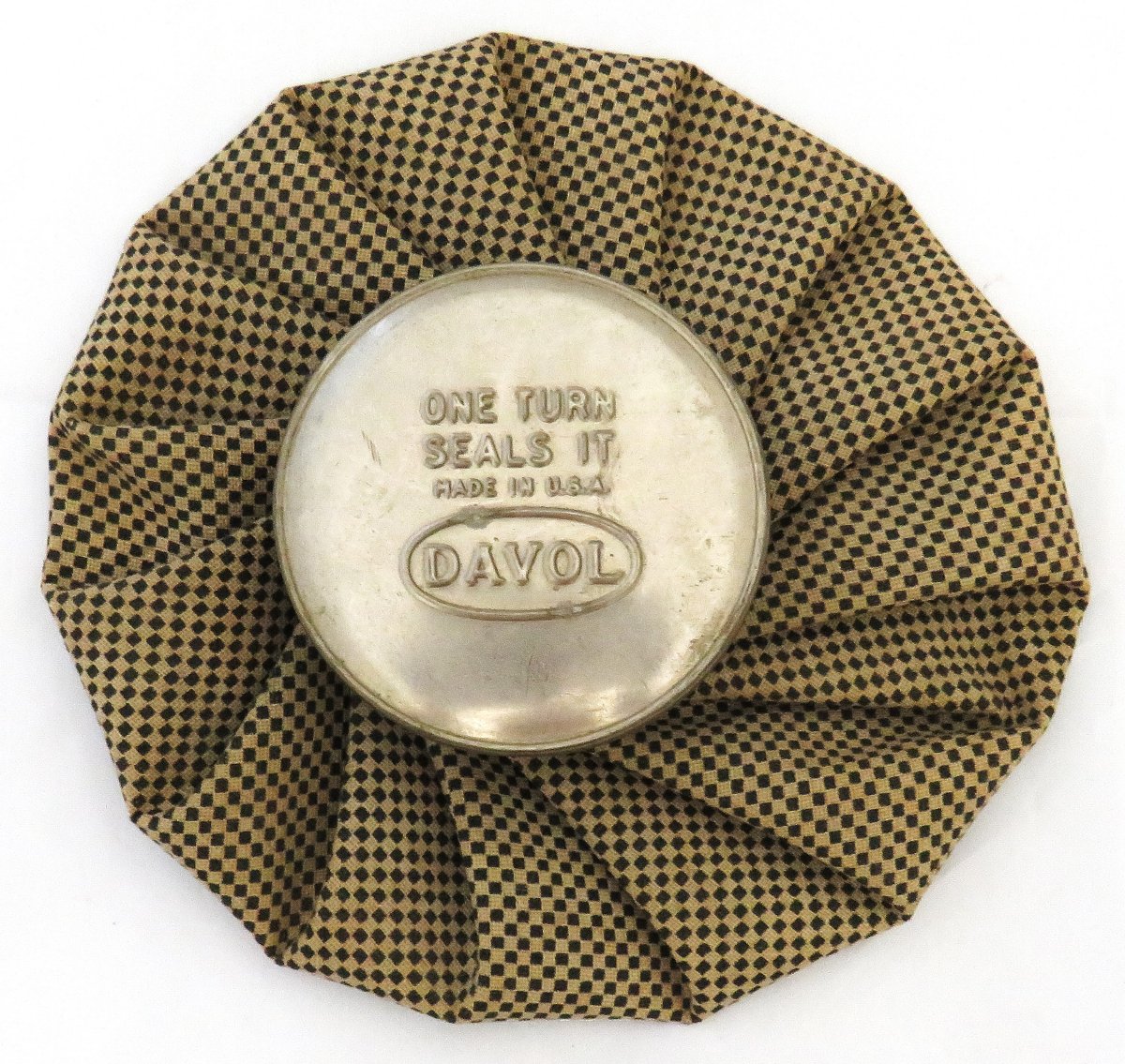 Checked brown cold pack with grey metal cap reading "One Turn Seals It // Made in USA // Davol"