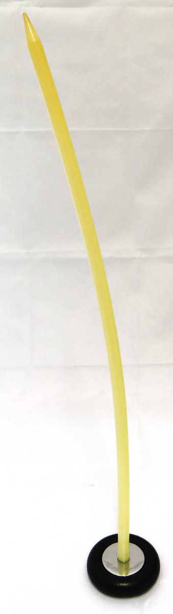 Reflex hammer with flexible yellow rubber handle and round black end.