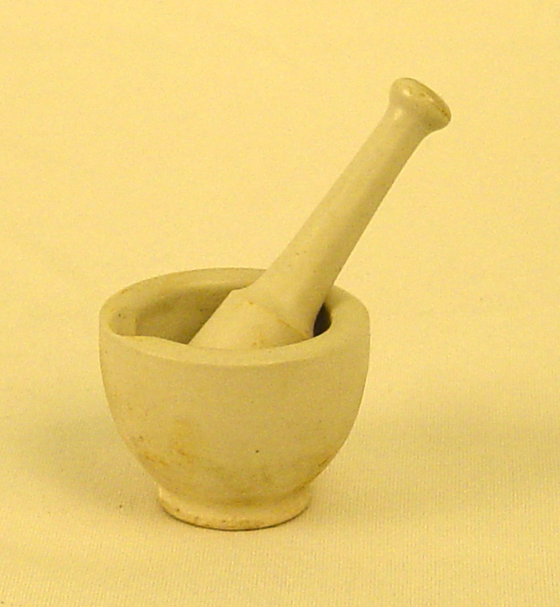 Stoneware mortar and pestle, white.